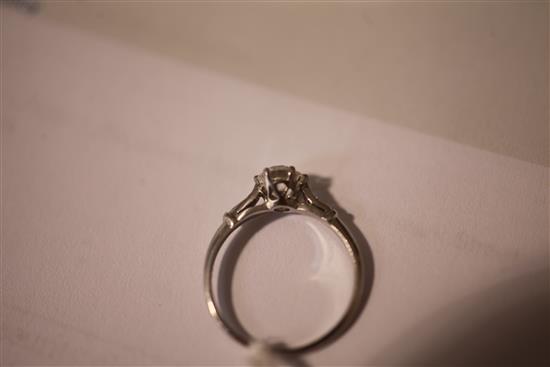 A white gold and single stone diamond ring, size M.